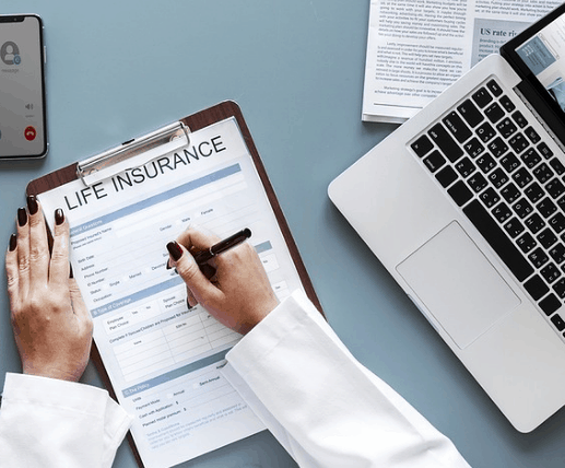 Signing a return of premium life insurance policy.