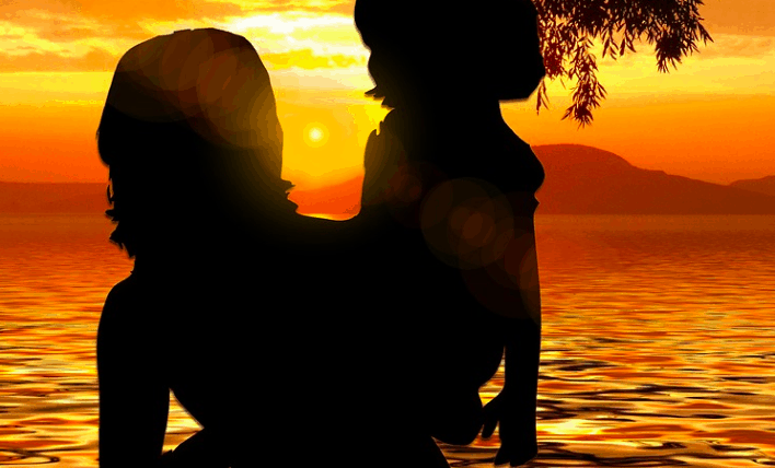 A woman needing loans for single moms holding her child.