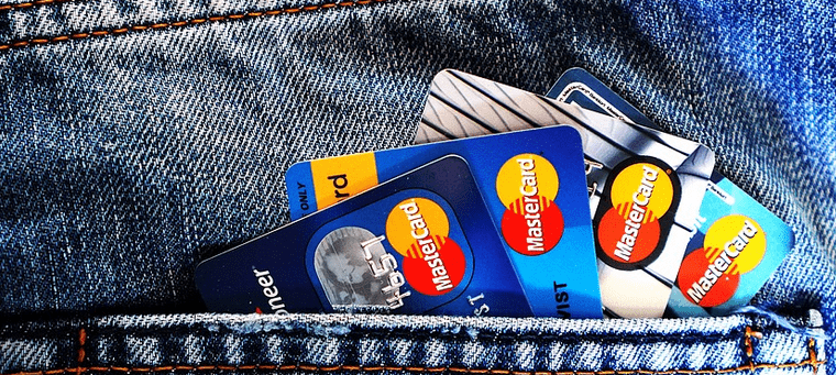 Credit cards in a pocket of a pair of jeans.