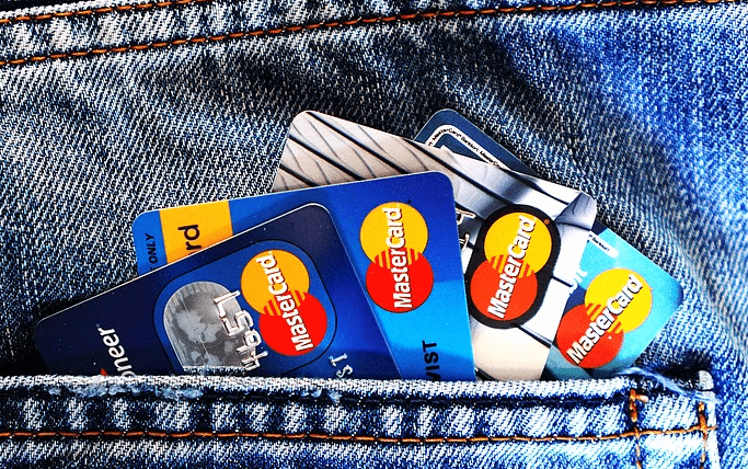 a lot of credit cards in a pocket.
