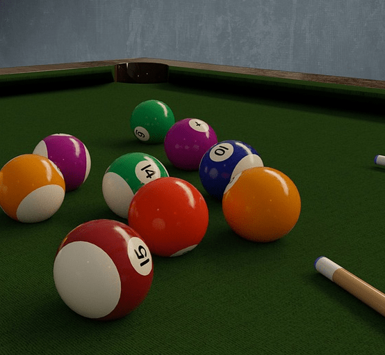 Playing on a pool table.