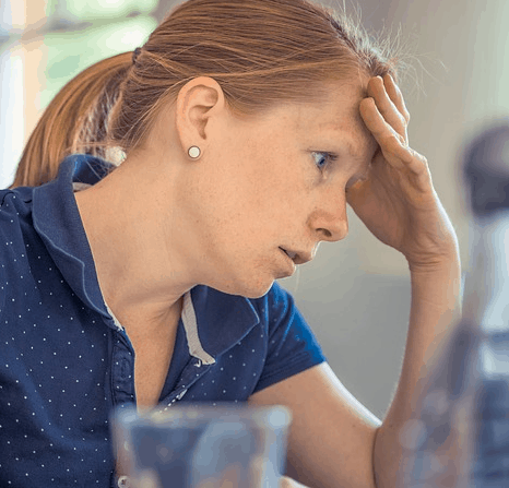 A woman stressed out over a $300 bill.