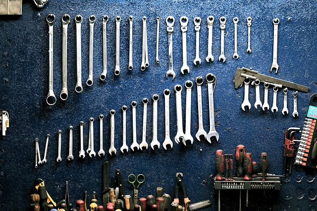 A collection of tools on the wall.