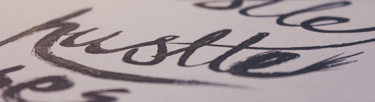 A business loan with hustle written on it. 